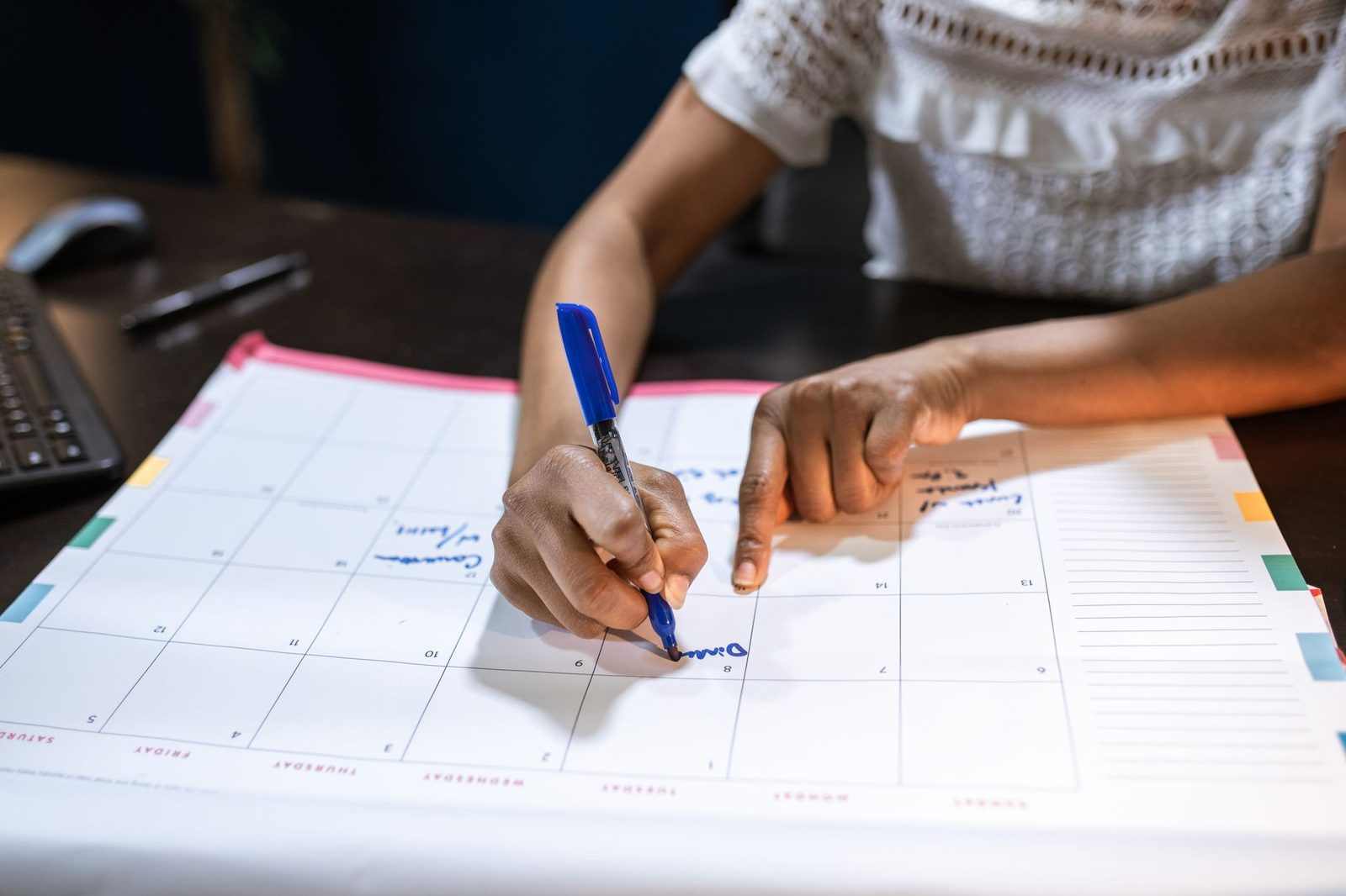 Student mapping out a study timeline at a desk