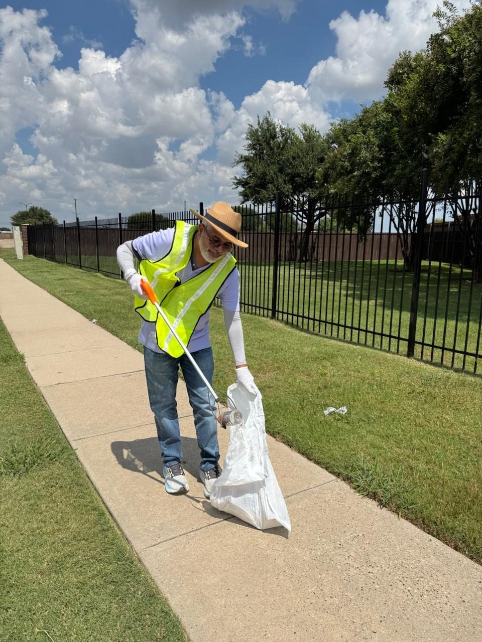 Hemant A - Carefully picking up bottles, wrappers, and cigarette butts along the sidewalks.