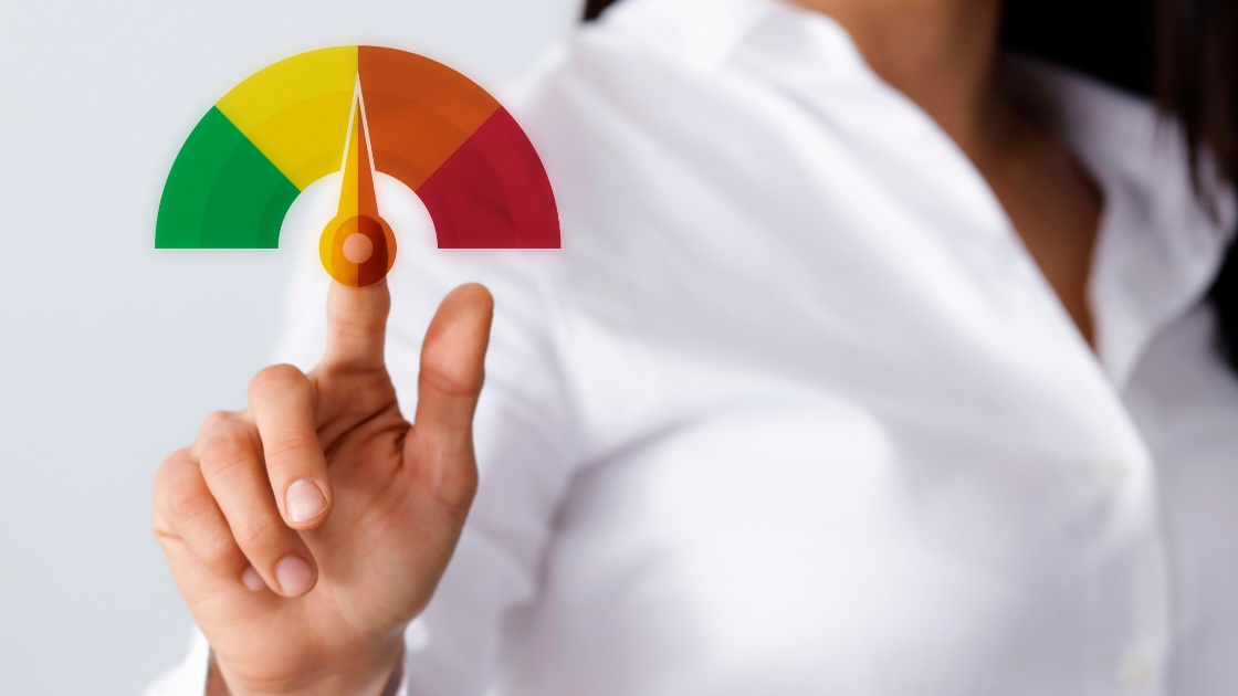 Hand pointing to score gauge illustrating how rare perfect SAT scores are and what the highest SAT score of 1600 is worth.
