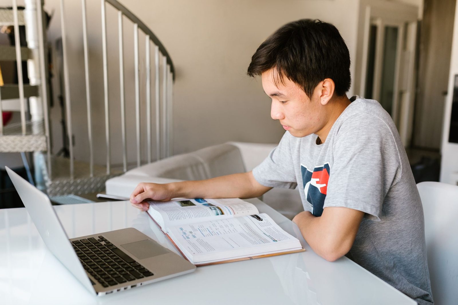 Student registering for AP exams on a laptop