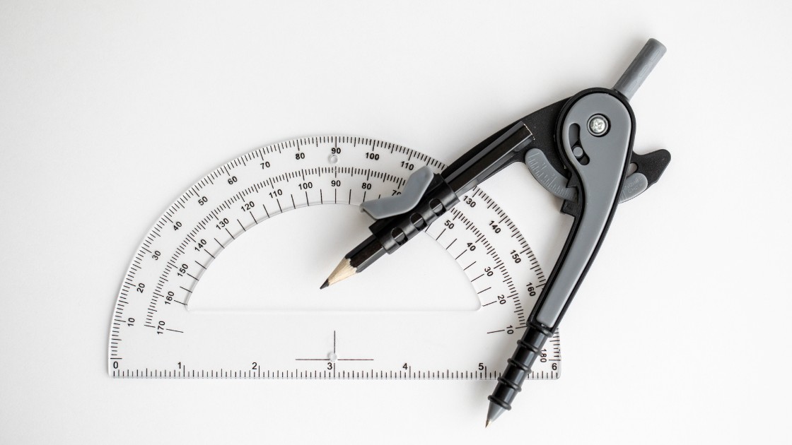 Compass and protractor showing essential SAT geometry formulas students use for triangles, circles, and coordinate problems.