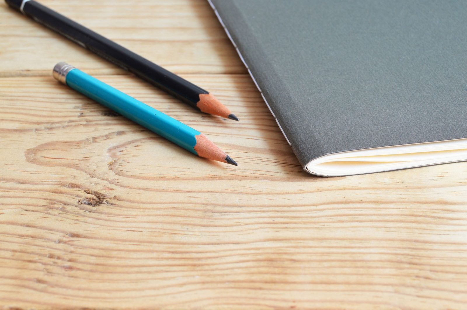 Student brainstorming college essay ideas in a notebook