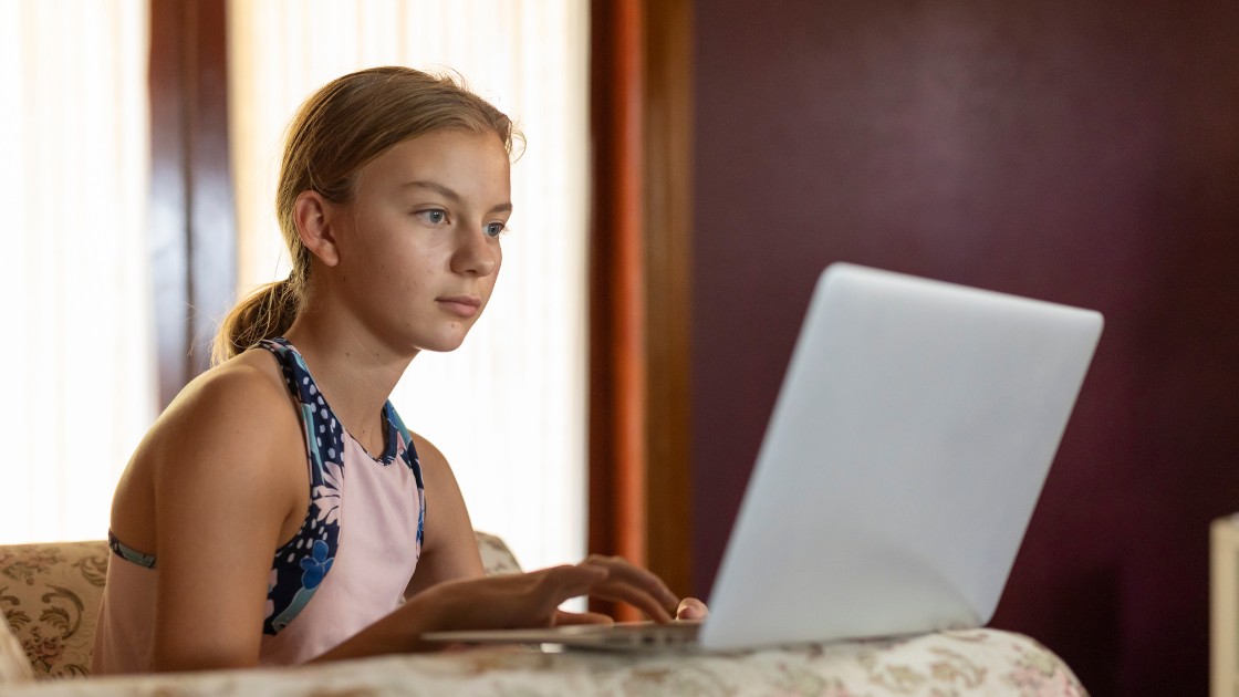 Student studying at desk while checking when do SAT scores come out in 2026, representing how to read score release windows.
